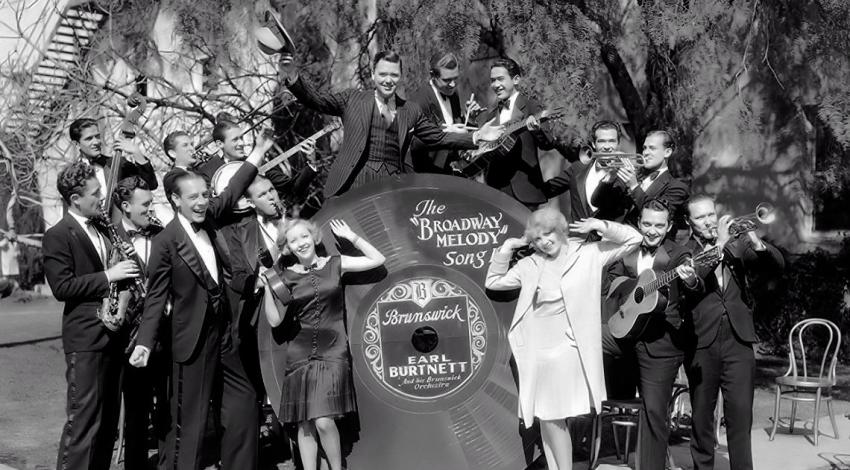 Nacio Herb Brown, James Burrows, Earl Burtnett, Eddie Bush, Paul Gibbons, Charles King, Ches Kirkpatrick, Eddie Lang, Bessie Love, Anita Page, Bill Seckler | "The Broadway Melody" (1929)